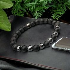 Men's bracelet, in natural stones, handmade Natural Stones approx. 8mm Lava Stone, Matte Black Agate, Hematite (Silver Plated). Separators are hematite 💎The Lava Stone: - Helps us become aware of the present moment in order to live in gratitude, joy and good humor. - Allows you to focus and live fully in the present moment. 💎Hematite: - Its peaceful energy helps counter insomnia and absorbs the tensions that make nights difficult. - Hematite uses the nourishing energy of the Earth to help comb Removing Negative Energy, Lack Of Energy, Good Humor, Men's Bracelet, Chronic Fatigue, Black Agate, Mens Bracelet, Handmade Natural