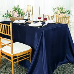 the table is set with two place settings for four people to sit down and eat