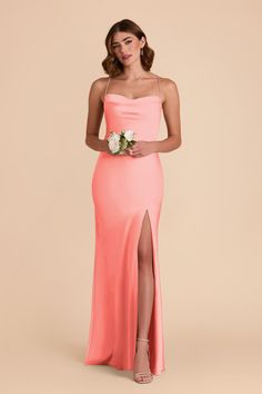 a bridesmaid in an orange strapless dress with a slit down the side