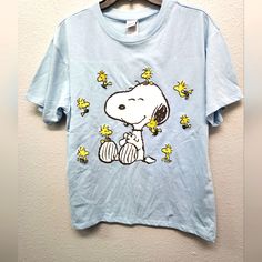 a t - shirt with a snoopy dog on it