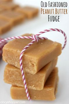 three pieces of fudge sitting on top of each other with twine around them