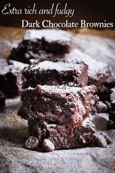 chocolate brownies stacked on top of each other with the words extra rich and fudy dark chocolate brownies