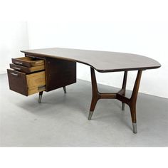 a wooden desk with two drawers on it