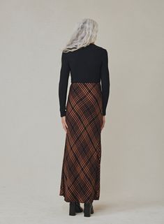 This Maxi Skirt in Autumn Ember Plaid is both stylish and is comfortable. Made with soft plaid fabric, the side slit adds a touch of elegance. Perfect for any season, this skirt will quickly become a staple in your wardrobe. 100% Rayon. SIZE WAIST WAIST TO HEM XS 26" 32 1/2" S 28" 33" M 30" 33 1/2" L 32" 34" Skirts Fall, Maxi Skirt Fall, Flannel Skirt, Print Maxi Skirt, Bella Dahl, Essential Dress, Printed Maxi Skirts, Fall Skirts, Plaid Fabric