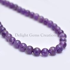 PRODUCT DETAIL :ITEM : AMETHYST BEADED NECKLACEITEM CODE :  DGC537ITEM NAME :NECKLACEGEMSTONE :  AMETHYSTBEADS SHAPE : SMOOTH ROUNDLENGTH :   18 INCH APPROXBEADS SIZE:  8-9 mm ApproxWEIGHT :  220 Cts. APPROXCUSTOMIZATION/BULK ORDER : AVAILABLEPLEASE FEEL FREE TO CONTACT IF YOU REQUIRE ANY FURTHER INFORMATION. Purple Round Crystal Healing Necklace, Purple Crystal Healing Necklace, Lavender Round Beads Spiritual Necklace, Purple Beaded Necklace With 8mm Beads As Gift, Purple Beaded Necklaces With 8mm Beads For Gifts, Amethyst Spacer Beads Jewelry, Purple Beaded Necklaces With 8mm Beads As Gift, Lavender Round Bead Crystal Necklaces, Lavender Crystal Necklaces With Round Beads