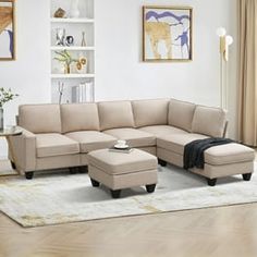 a living room with a sectional couch and ottoman