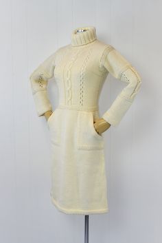 "Info: ♥ Circa: 70s ♥ Label: Courreges (tag is missing but the embroidery on the bodice is unmistakable) ♥ Color: Cream ♥ Material: Wool ♥ Condition: Excellent vintage condition. Details: ♥ Cozy Courreges sweater dress ♥ Soft cream colored wool ♥ High turtleneck ♥ Two pockets, one on each side ♥ Pullover style, no closures ♥ Unlined Measurements: Bust: 32\"-snug 40\" Waist: 28\"-32\" Hips: 38\"-42\" Length: 42.5\" Sleeve Length: 19\" ♥ ♥ All garments are measured flat, then doubled for the bust, Retro Fitted Vintage Dress For Winter, Fitted Retro Vintage Dress For Winter, Vintage Cream Dress For Fall, Retro Winter Daywear Dresses, Retro Winter Day Dresses, Vintage Winter Daywear Dresses, Vintage Beige Winter Dress, Vintage Beige Dress For Winter, Vintage Beige Dresses For Winter