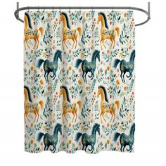 a shower curtain with horses and flowers on the outside, in front of a white background