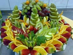 a fruit arrangement is displayed on a table