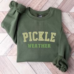 Vintage Canned Pickles Sweatshirt, Canning Season Sweatshirt, Pickle Lovers Sweater, Homemade Pickles Sweater,Pickle Jar Crewneck Sweatshirt * Unique cute gift for everyone that is incredibly easy and stress-free to order & receive * Design is a the words Golden mama writing with trendy retro color and font. * Softest quality 50% cotton, 50% polyester with loose fit that runs true to size (unisex) * Extreme comfort with no bulky side seams for great shape and fit that lasts * Collar is ribbed knit, so it retains its shape even after washing * Our unique designs are professionally permanently printed with Direct to Garment printing which feels smooth and flexible :: Printed with Eco-Friendly Inks :: Printed and Shipped from the USA :: Double-Needle Stitching Throughout :: Made to Last *50% Green School Tops For Fall, Green Fall School Top, Fall Cotton Tops With School Spirit Style, Fall Cotton Tops For School Spirit, Green Cotton Sweatshirt For School, Cute College Tops For Fall, Green Long Sleeve Tops For School Spirit, Relaxed Fit Tops For School In Fall, Collegiate Tops For School In Fall