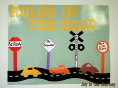 a bulletin board with cars on the road and street signs in front of it that says rules of the road