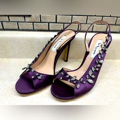 Elevate Your Style With These Stunning Nina Deanne Slingback Heels. Featuring A Gorgeous Purple Color And Adorned With Crystals That Bling, These Shoes Will Make You Stand Out In Any Occasion. The Ultra-High Stiletto Heel Adds A Touch Of Sophistication And Elegance, While The Open Toe Design And Slip-On Closure Provide Comfort And Convenience. Perfect For Weddings, Parties, Formal Events, Or Even Just A Night Out, These Heels Are Sure To Turn Heads. The Leather Lining And Outsole Material Ensure Elegant Purple Sandals For Evening, Elegant Purple Evening Sandals, Purple Slingback Heels For Summer, Elegant Purple Sandals With Padded Heel, Summer Purple Slingback Heels, Purple Heel Strap Slingback Pumps For Evening, Purple Slingback Pumps With Heel Strap For Evening, Purple Slingback Pumps With Heel Strap For Party, Elegant High Heel Purple Sandals