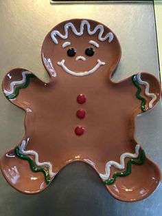 a cookie shaped like a ginger on top of a table