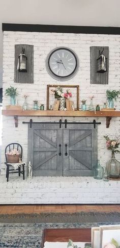 a living room filled with furniture and a large clock on the wall over a fireplace