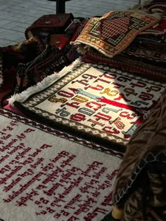 the rugs are laid out on the floor for display and to be used as decorations