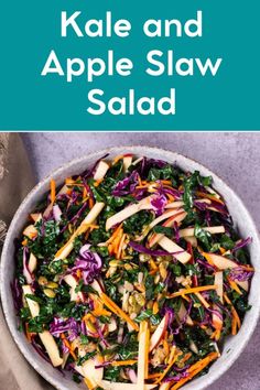 kale and apple slaw salad in a white bowl on top of a table