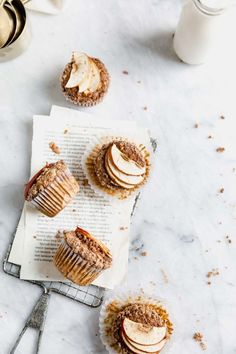 three muffins with apples and cinnamon on top