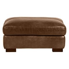 a brown leather footstool on a white background