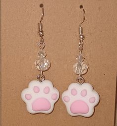 These earrings nothing short of adorable! They're a simple cats paw in polymer clay with crystal beading. Toe Beans have never been so cute! The clips are hypoallergenic and Nickle/Lead free. All earrings are also available in Clip On options! Please message me when you place your order and I can convert them before shipping. Please allow one additional S&H day for the change. If there is an issue with your order please contact me immediately for resolution. Cat Earrings Diy, Simple Polymer Clay Earrings, Clay Charm Earrings, Cat Earrings Polymer Clay, Polymer Charms, Paw Earrings, Handy Craft, Cats Paw, Toe Beans