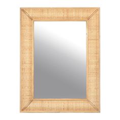 a mirror that is sitting on top of a white wall and it has a wooden frame