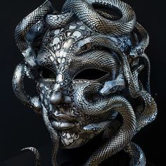 This stunning handmade Medusa mask is a true work of art. Featuring an intricate design of intertwined snakes in silver tones, it captures the mystical and fascinating essence of ancient mythology. Every scale and curve has been meticulously crafted to create a piece that is both elegant and terrifying. By putting it on you not only acquire a mask, but a jewel of mystery and supernatural beauty that turns any occasion into a memorable event. All models are made in Italy and the Netherlands ⬇️ an Fantasy Mask Design, Creatures Sketch, Medusa Mask, Snake Mask, Intertwined Snakes, Nature Mask, Masquerade Mask Black, Custom Masks, Costumes Scary