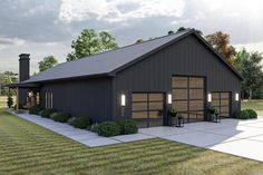 a black garage with two doors and three windows on the side of it, surrounded by grass