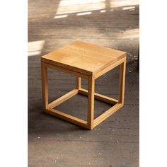 a wooden table sitting on top of a hard wood floor