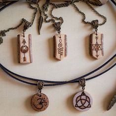 the necklaces are decorated with different symbols