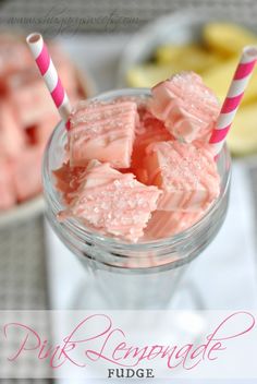 pink lemonade fudge in a glass with two striped straws