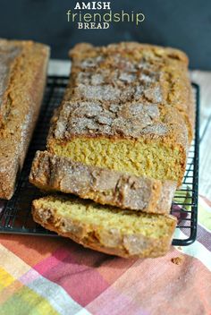 two slices of pumpkin bread sitting on top of a cooling rack next to each other