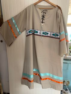 Ladies Size XLarge - XXLarge Bust 44-50" OOAK Handmade Pow Wow RIBBON DRESS Running Horses, Chevrons, Dream Catchers, Southwestern, Native American Symbols Native American Regalia, Ceremonial Dress This is a variation of a prairie costume dress.  I did not have a pattern.   Adjustable neck, loose-fitting garment accommodates several sizes and shapes Allow one week turnaround for your custom size The dress pictured is ready to ship This dress is one-of-a-kind, designed in my small studio on the shores of  Lake Chargogagoggmanchaugagoggchabunagungamaugg, locally known as Webster Lake.   YOU WILL RECEIVE THE DRESS DISPLAYED.  Smooth poly cotton blend, no iron. All fabric has been pre-washed prior to adding ribbon.  This one has a real bone antler button at neck tie!  Dress could be belted to Ribbon Dress Native American, Mens Ribbon Shirt Native American, Ribbon Skirts Native American Shirt, Navajo Ribbon Skirt, Native American Grass Dance Regalia, Horse Dress, Native Dress, Dress Display, Native American Regalia