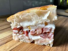 a close up of a sandwich on a wooden table