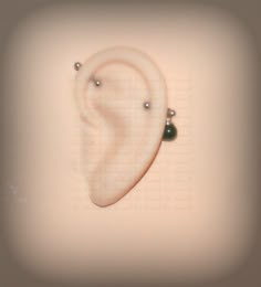 a pair of ear piercings are shown in this artistic photo with the word love written on it