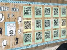 a person standing in front of a wall with qr code on it