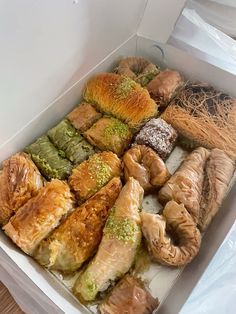 a box filled with different types of pastries