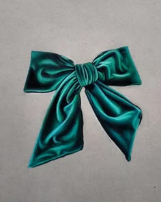 a painting of a green bow on the ground