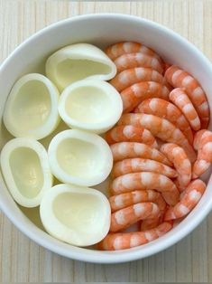 peeled shrimp and hard boiled eggs in a bowl