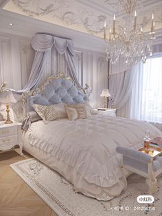 a large bed sitting in a bedroom next to a chandelier and two nightstands