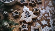 christmas cookies and decorations on a wooden table