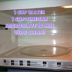 a microwave with the words 1 cup water 1 cup vinegar microwave 10 min wipe clean