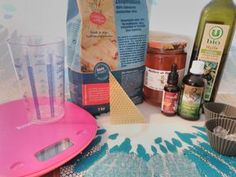 the ingredients for making an iced tea cupcake are displayed on a blue and white tablecloth