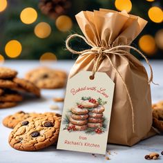 a bag full of cookies next to some cookies on a table with lights in the background