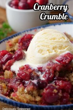 cranberry crumble with ice cream on top in a blue and white bowl