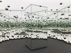 several mirrors with balls in the middle of them