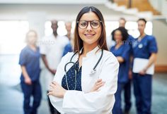 a group of doctors standing together in the hallway - stock photo - images and clippings