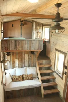 the interior of a tiny house with stairs