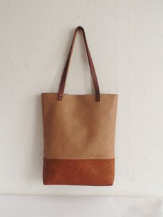 Large vegan leather tote - color block vegan leather tote bag in cognac brown and caramel/toffee brown. * Exterior: - Bottom - high quality vegan leather in cognac brown color -Top - high quality very durable vegan leather in sandy\caramel\toffee brown color * Interior: - Available with natural cotton polka dot lining in sandy beige and white or natural linen geometric print pattern in light beige. Please choose the lining you prefer from Variations. * Two inside slip pockets * Real leather hand Rectangular Caramel Bag With Leather Handles, Caramel Rectangular Bags With Leather Handles, Rectangular Caramel Bags With Leather Handles, Caramel Tote Shoulder Bag, Caramel Tote Bag For Shopping, Camel Tote Bag For Errands, Caramel Travel Tote Bag, Dark Tan Tote Bag With Leather Handles, Brown Tote Shoulder Bag