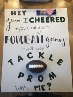 a handwritten sign with a football on it