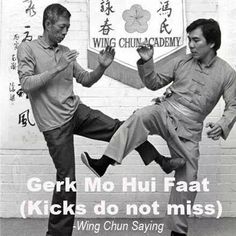 two men are doing karate in front of a sign with the words master jimfugs wing chun academy