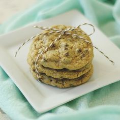 chocolate chip cookies tied with twine on a white plate